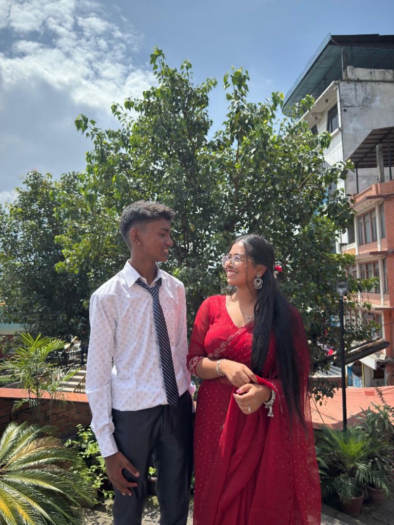 wearing red saree looking lovingly